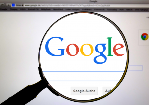 Magnifying Glass Showing Google Search Bar