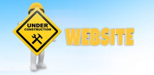 image of man holding under construction sign for a website