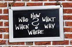 Sign On Wall With How What Questions