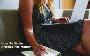 Woman sitting with computer on lap writing on a writing pad