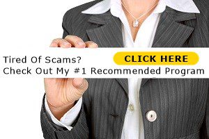 Woman holding a sign with tired of scams written on it