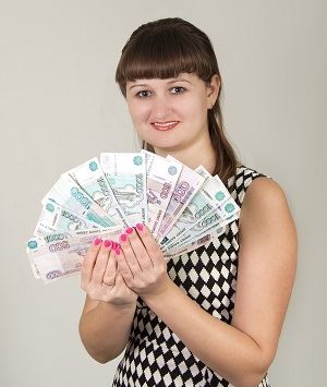 Woman holding banknotes fanned in her hands