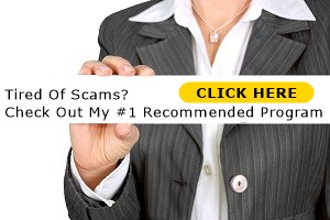 Woman holding up a sign with the writing tired of scams check out my number one recommended program